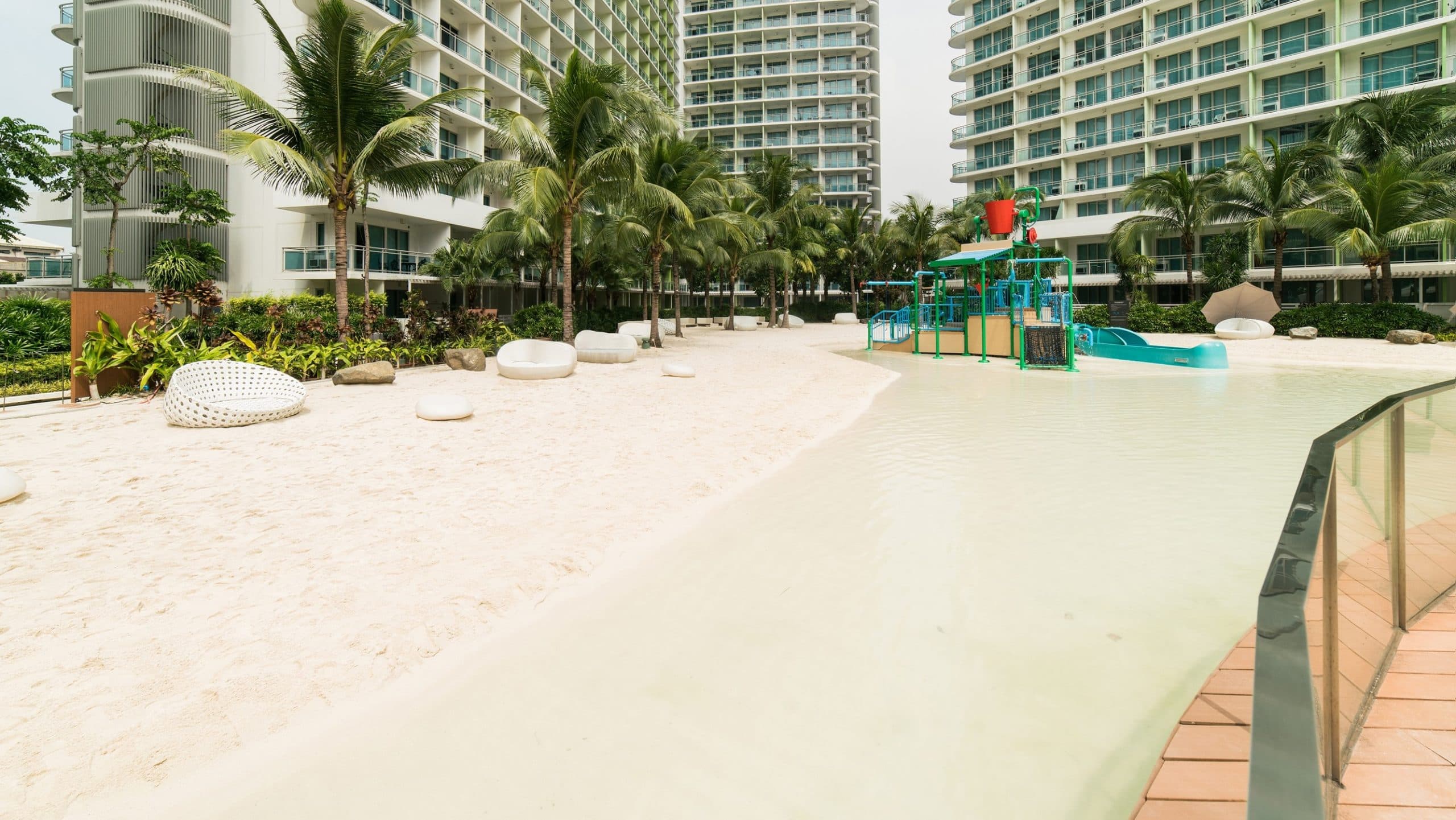 Outdoor Azure beach amenity with sand and resort water